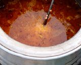 A picture of step 2 of Desi Masar and moong daal Mix on wood fire.