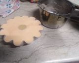 A picture of step 7 of Orange coloured Egg Pudding.