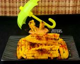 A picture of step 4 of Butter Garlicky Spicy Grilled Crispy Curly Corn Ribs - With Schezwan Dip Corn Ribs Monsoon Munching.