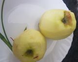 A picture of step 2 of Apple Cake twisted garnishing with milkmaid and honey.