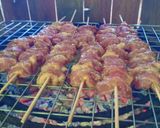 A picture of step 18 of Grilled Pork Skewers with Fresh Coconut Milk (10 Baht per Skewer).