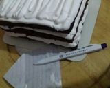 A picture of step 10 of Snow village cake.