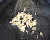 A picture of step 2 of Garlic & white wine sauce for vegetables.