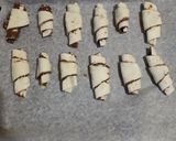Foto del passaggio 3 della ricetta Cornetti pasta sfoglia alla nutella express