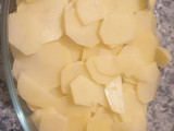 Merluza al horno con patatas panadera