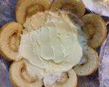 A picture of step 9 of Peach Swiss roll Ice cream Cake.