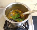 A picture of step 4 of Gujarati lunch (rasadar aloo sabji, amrakhand, puri, dal, rice).