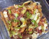 A picture of step 6 of Loaded Pizza fries.