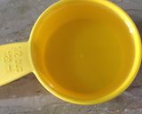 A picture of step 3 of Orange flavour cake on stove.