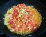 Foto del paso 7 de la receta: Pimientos rellenos con bacalao y arroz sobre salsa de tomate