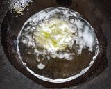 A picture of step 5 of Jowar Spinach Mathri.