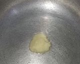 A picture of step 1 of Garlic rice.