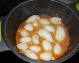 Foto del paso 4 de la receta: Chipirones rellenos de langostinos en salsa