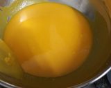 A picture of step 5 of Mango Blondie Bars with M&Ms.