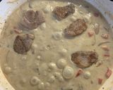 A picture of step 14 of Pork Medallions in a Mushroom and Sherry creamy sauce.