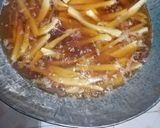 A picture of step 2 of Orange flavoured chips masala.