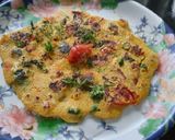 A picture of step 8 of Besan onion tomato chilla.