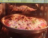 A picture of step 4 of Italian thin crust pizza.