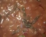 A picture of step 3 of Ulli theeyyal (shallots cooked in roasted coconut gravy and tamarind juice).