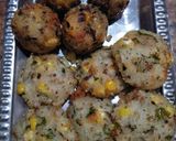 A picture of step 6 of Dhokla in idli version stuffed with cheezee rice patty.