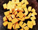 A picture of step 1 of Red Pumpkin/Kaddu Dry Curry.