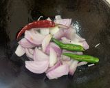 A picture of step 2 of Pyaj Karela fry (Onion and bitter gourd fry).