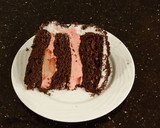A picture of step 32 of Chocolate Layer Cake with Strawberry Cream Filling, White Chocolate Ganache Frosting coated with a Chocolate Crumble.