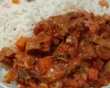 A picture of step 4 of Beef and mushroom stew paired with garnished coconut rice.