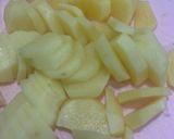 A picture of step 1 of Achari Aloo Baingan.