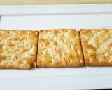 A picture of step 4 of Hummus three ways with cracker.