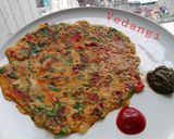 A picture of step 5 of Besan Palak Cheela.
