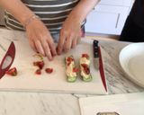 A picture of step 5 of Cucumber hummus boat.
