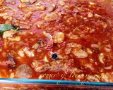 Foto del paso 8 de la receta: Manitas de cerdo con tomate, jamón y morro