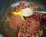 A picture of step 2 of Masala laccha paratha with aloo matar in tomato gravy.
