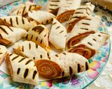 A picture of step 4 of Tortilla Rolls with Ham and Cheese.
