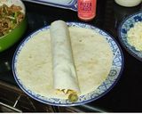 A picture of step 7 of Cheesy Mexican Chicken Fajita Wraps.