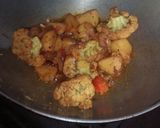 A picture of step 22 of Aloo fulcopi katla rosha ar misti doi.