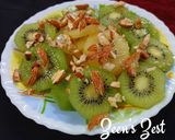 A picture of step 3 of Green and Sun Gold Kiwis Salad with toasted Almonds.