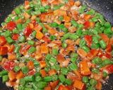 A picture of step 5 of Manchow Soup / Veg soup topped with Crispy fried noodles.