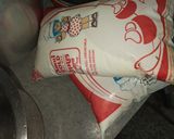 A picture of step 9 of Dodha Burfi with Daliya.