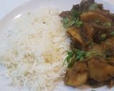 A picture of step 9 of Aaloo bangan with white rice.