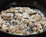 A picture of step 1 of Ghooguni (Spicy White peas curry).