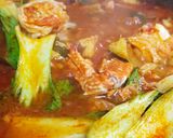 A picture of step 6 of Jjampong (Korean Spicy Seafood Noodle Soup).