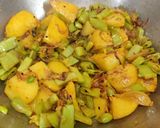 A picture of step 5 of Sem Aloo with Kalonji Seeds.