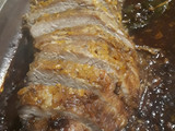 Bondiola de cerdo en salsa de naranja y comino
