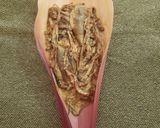 A picture of step 7 of Banana flowers dip in mustard seeds.