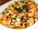 Foto del paso 6 de la receta Salteado de champiñones con ajetes y langostinos