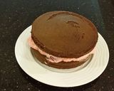 A picture of step 23 of Chocolate Layer Cake with Strawberry Cream Filling, White Chocolate Ganache Frosting coated with a Chocolate Crumble.