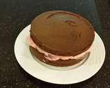 A picture of step 23 of Chocolate Layer Cake with Strawberry Cream Filling, White Chocolate Ganache Frosting coated with a Chocolate Crumble.