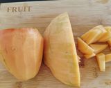 A picture of step 1 of Muskmelon and papaya salad.